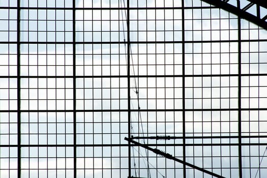 The close-up of the side entrance of a station against a sky.