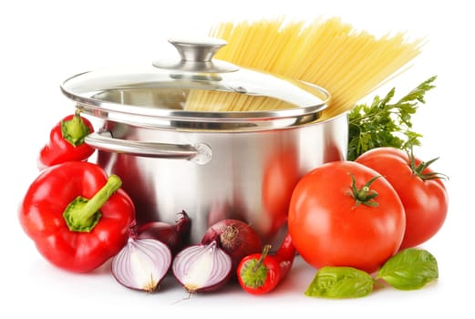 Stainless pot with spaghetti and variety of raw vegetables isolated on white