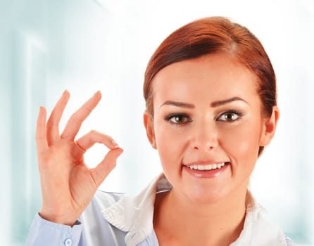 Young woman showing ok gesture
