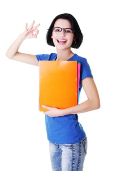 attractive woman / student holding files and showing ok. isolated on white.
