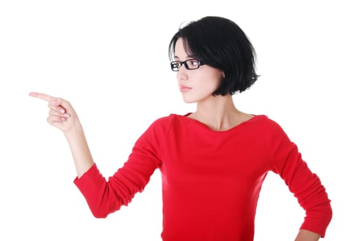 attractive woman in eyeglasses points on side. isolated on white.