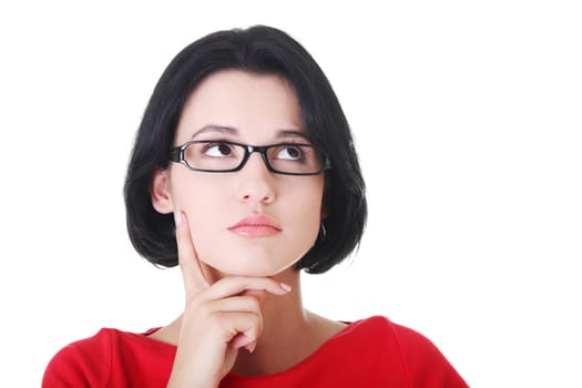 attractive woman in eyeglasses is looking up and thinking. isolated on white.