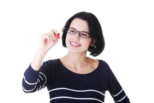 attractive woman with pen trying to write on copy space. isolated on white.