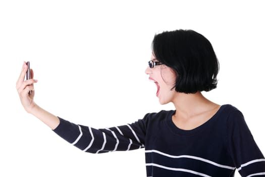 attractive woman shouting to the phone. isolated on white.