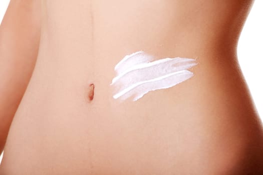 slim sexy female's belly with body lotion. closeup. isolated on white.