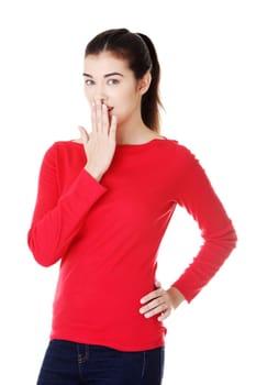 attractive woman covering her mouth. isolated on white.