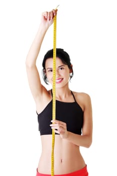 attractive fit slim woman with measuring tape. isolated on white.
