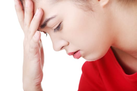 casual woman holding her head. isolated on white.