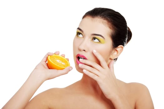 beautiful woman with orange over the white background.