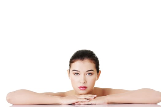 naked woman lying on the table.isolated on white.