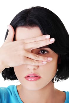 portrait of young attractive woman's face covered eye by hand. isolated on white.