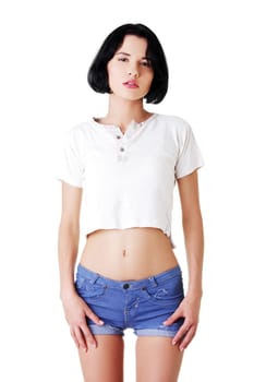 young attractive woman in shorts and t-shirt. isolated on white.