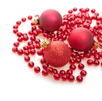 Christmas Background - Red Christmas Baubles on White Background - Shallow Depth of Field