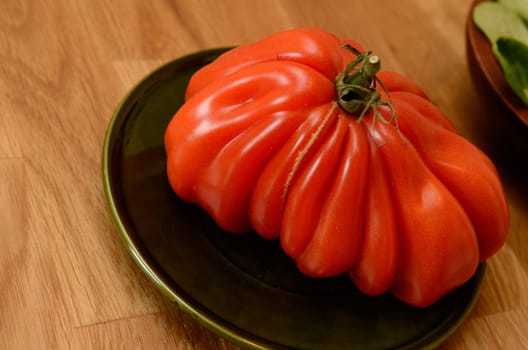 Big tomato on a wooden table