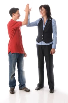 Adult woman and teenage boy clapping and shaking hands