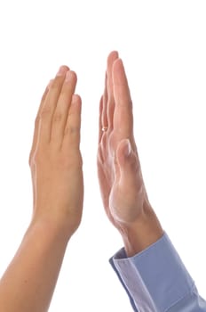 Adult woman and teenage boy clapping and shaking hands against a white background.