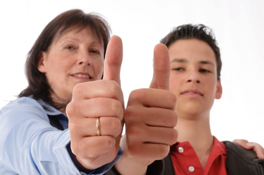 Mother and son get along splendidly and make a "thumbs up"" gesture together in front of a white background."