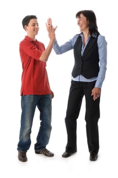 Adult woman and teenage boy clapping and shaking hands