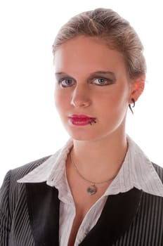 Young woman in a grey business suit and high heels ... in front of a white background