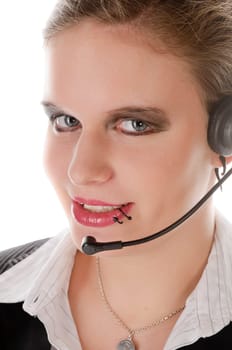Young woman in a grey business suit with lots of make-up and piercings,portrait with telephone headset against a white background