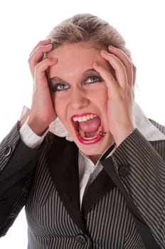 Young woman in grey business suit and high heels is horrified and desperate in front of a white background,portrait