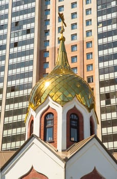 Dome of orthodox Churce on the modern building background.Taken in Sankt Petersburg, Russia.