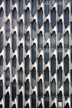 The photograph of a modern façade in front of a staircase.