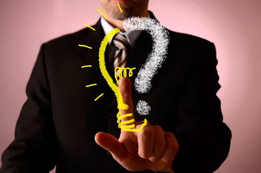 Business man pointing on a light bulb