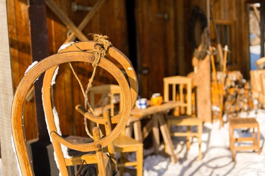 Detail of wooden sledge outside winter snow cottage