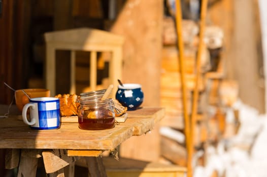 Winter morning breakfast outside wooden cottage snow