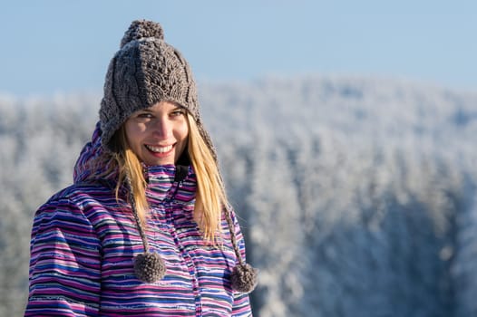 Young woman portrait winter mountains snow smiling sunny countryside