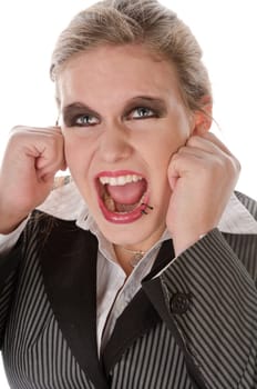 Young woman in grey business suit and high heels is horrified and desperate in front of a white background,portrait