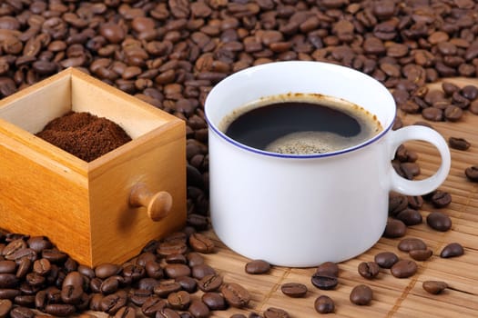 Cup of coffee with coffee beans