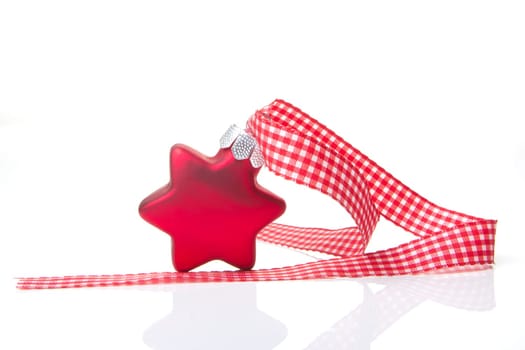 red poinsettia with red ribbon and white background