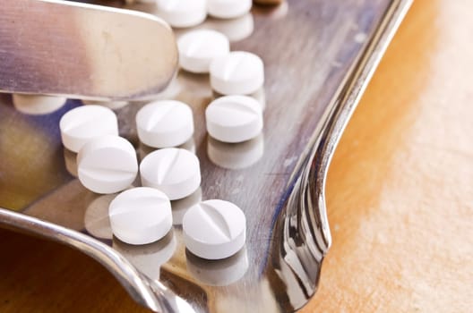 Close up of medical pills on stainless steel tray..(Health care and medical concept)