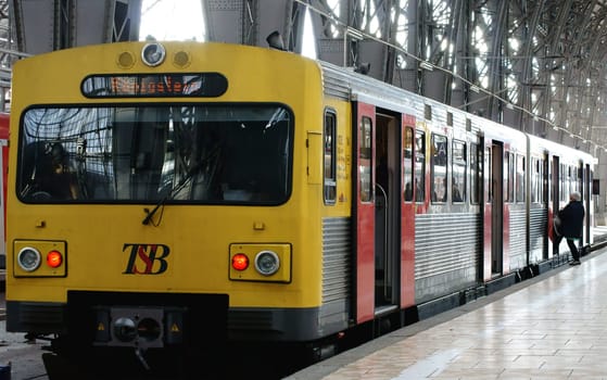 Frankfurt,Germany – November 07,2013: The interior shot of Frankfurt Central Station with an unknown traveler boarding a historic train in Frankfurt on November 7,2013.