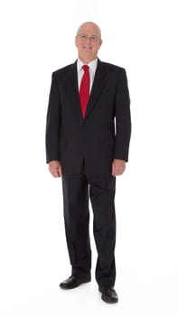 Full length photo of mature businessman standing on white background.