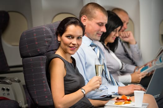 Business travel by airplane woman enjoy refreshment flight cabin passenger