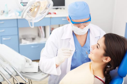 Young girl during oral checkup at the dentist’s