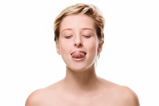 Woman tries to reach her nose with her tongue on a white background