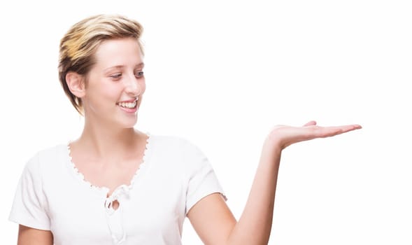 Young woman shows empty hand for product placement on white background