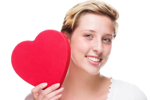 Happy woman holds red heart on white background