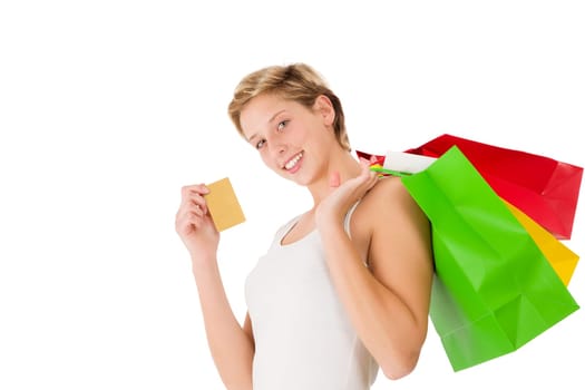 Happy woman with shopping bags and credit card on white background