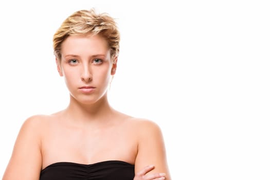 Portrait of a serious young woman on a white background
