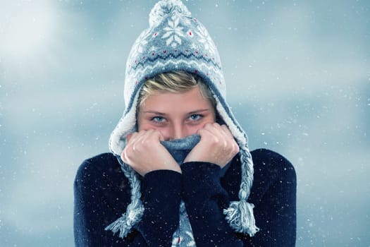 Young woman in winter freezing in the snow