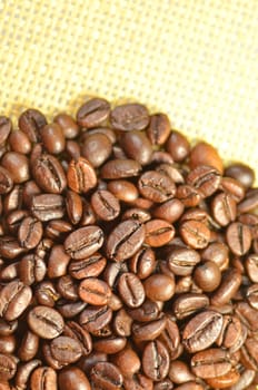 roasted coffee beans on linen surface