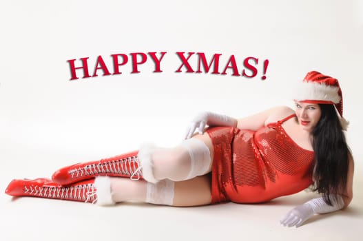Big woman with sexy Christmas clothes and red boots lies under the HAPPY XMAS! Lettering. Insulated against a white background.