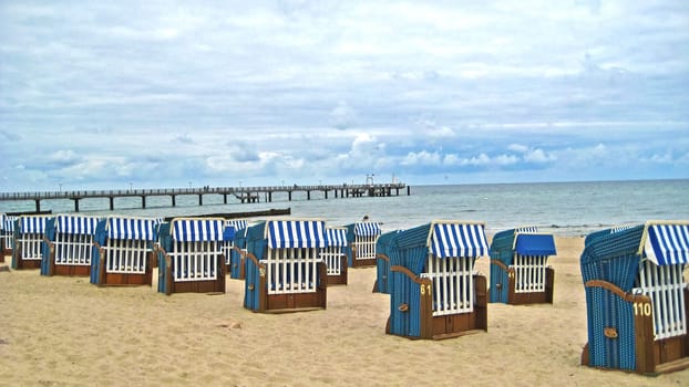 Beach chairs in front of the pier in Kühlungsborn, Baltic Sea, Germany