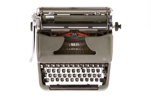 A military green old mechanical typewruter on a white backround