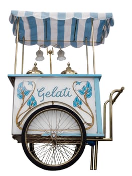old single-axle ice cream van with white-blue awning and the inscription "Gelati"" in side view on white background"